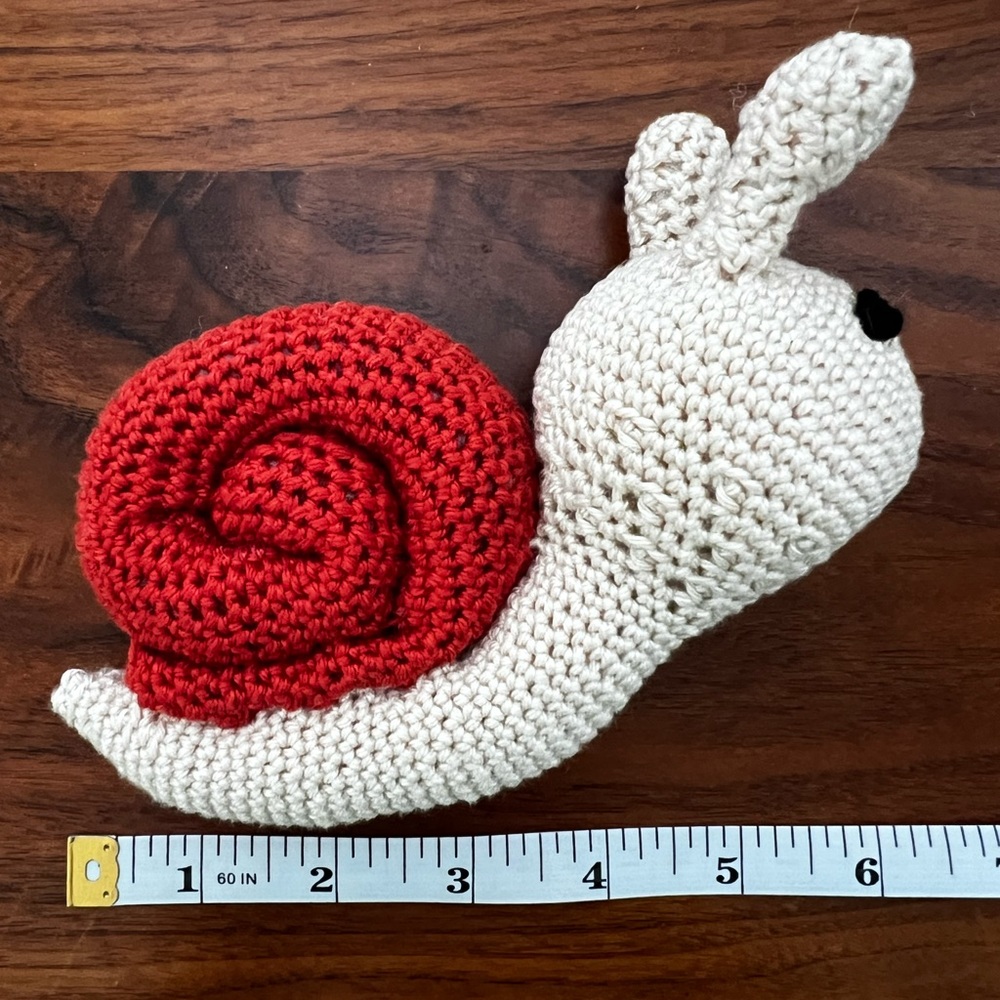 Hand a crocheted Sammy the Snail (Small)🐌 - Picture 3 of 7